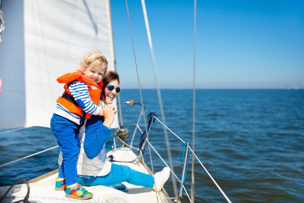 A mom and son on a boat on the Chesapeake during a Mother's Day vacation