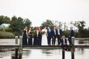 A wedding party posing for a photo at a wedding venue in Rock Hall, MD