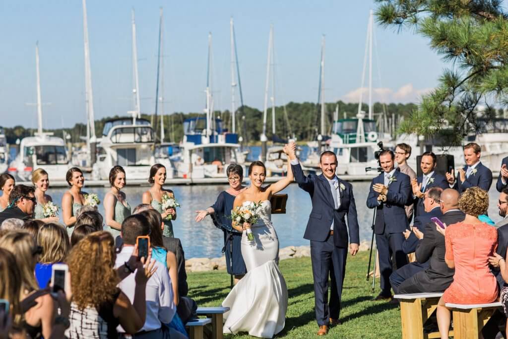 A couple celebrating their marriage at Osprey Point, a Rock Hall wedding venue