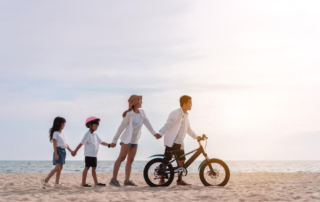 A family of four walking and biking on the Rock Hall Loop