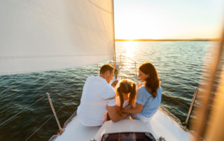 A family of three on a yacht in Rock Hall, MD