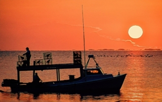 Maryland Watermen fishing on the Chesapeake at sunset