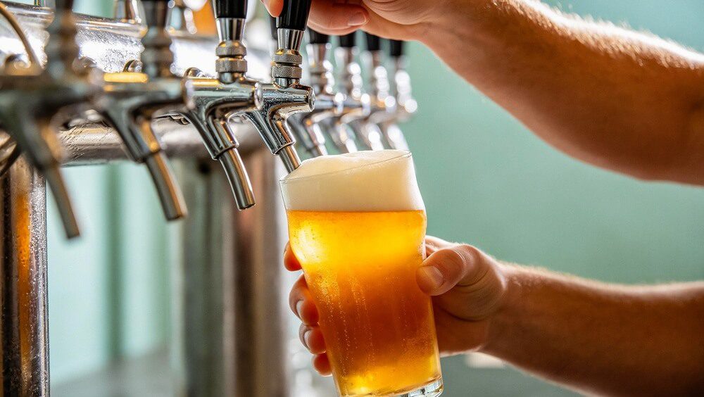 A craft beer being poured from the tap at an Eastern Shore brewery